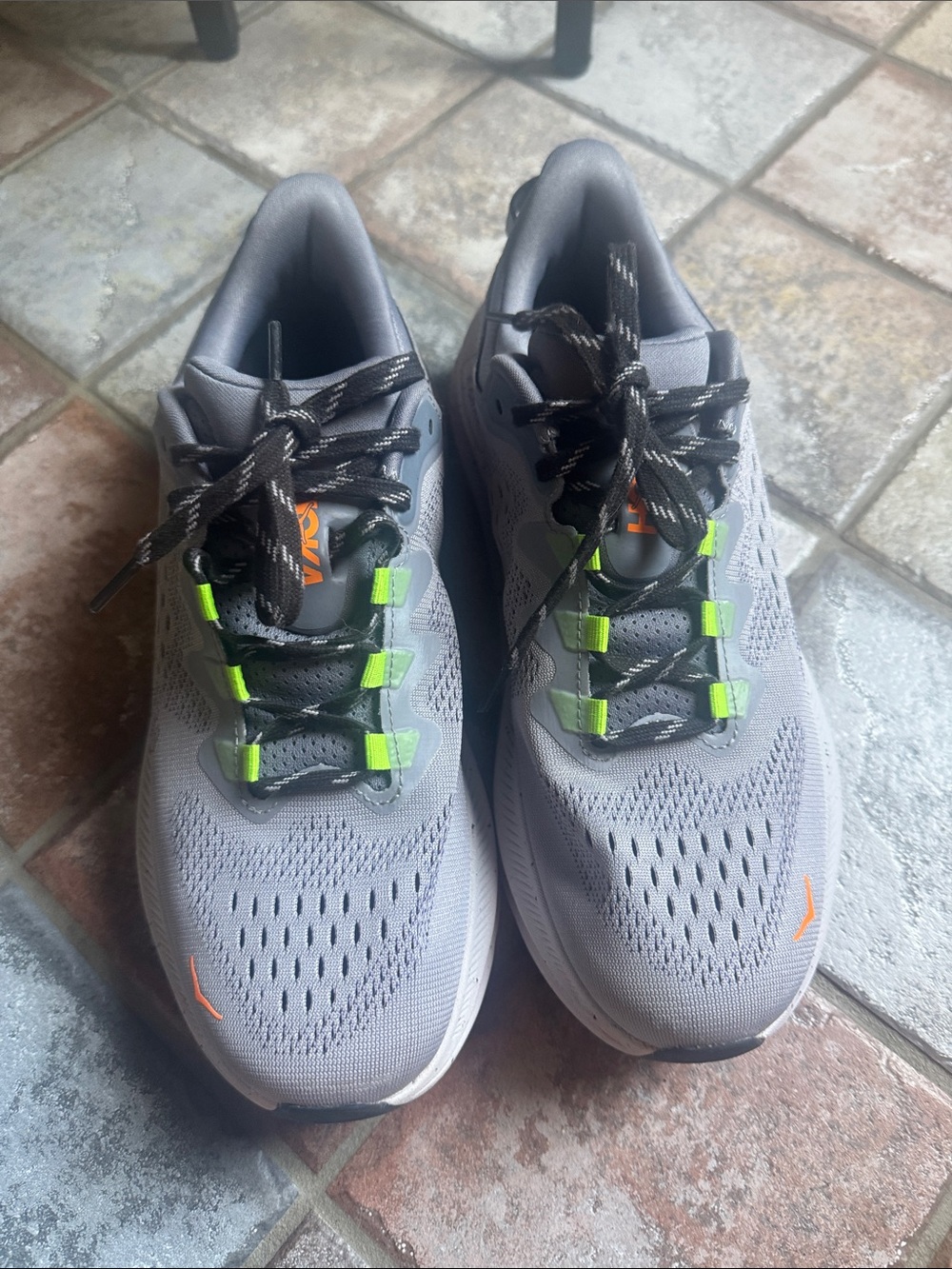 Hoka Men's Gray Running Shoes with Neon Green and Orange Accents